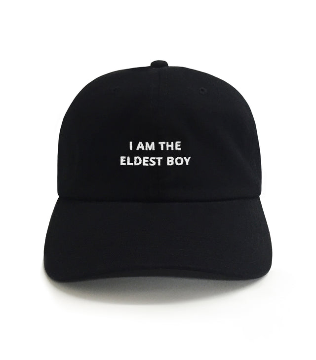 I Am The Eldest Boy Dad Hat – Black embroidered 6-panel cotton hat for dads and brothers. Funny hat gift by Dad Brand.