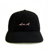 Black cap with 'dad' embroidered on a white background